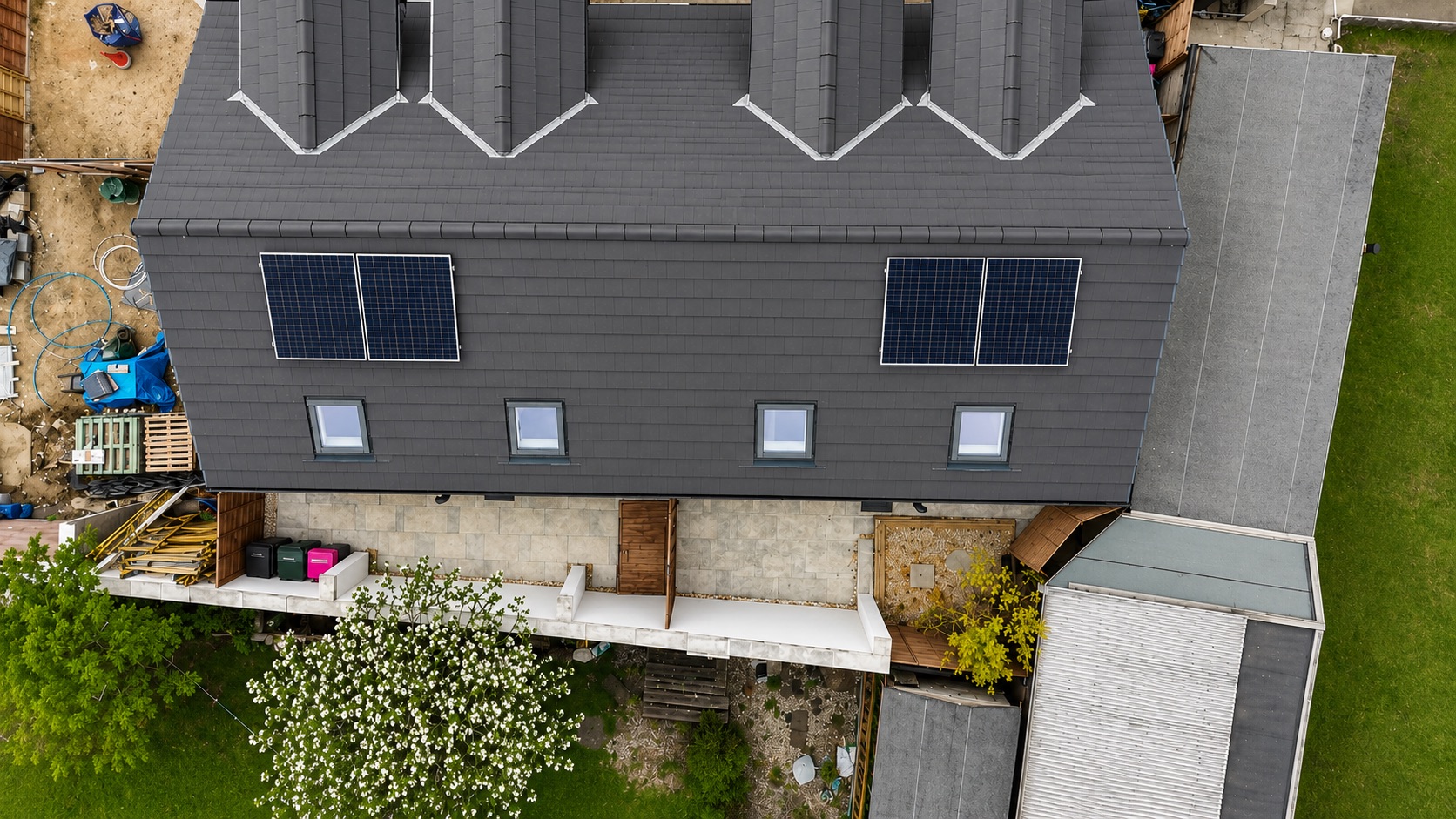 Aerial drone photo of a re-roofed property with solar panels